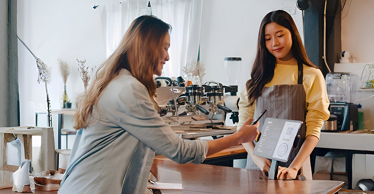 Customer scanning QR code to pay at store